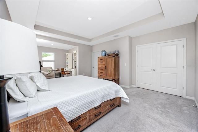 8423 Praise Dr, Tampa, FL 33625 - bedroom featuring a raised ceiling, light carpet, baseboards, and recessed lighting
