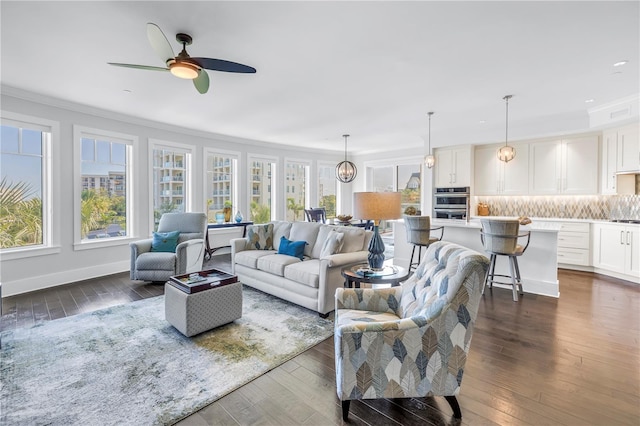 125 Belleview Blvd Unit 203, Belleair, FL 33756 - living area with ornamental molding, plenty of natural light, a ceiling fan, dark wood-type flooring, and recessed lighting
