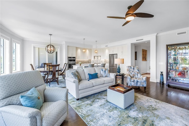 125 Belleview Blvd Unit 203, Belleair, FL 33756 - living room featuring dark wood finished floors, a chandelier, crown molding, and ceiling fan