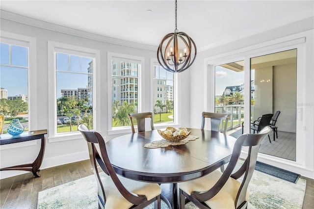 125 Belleview Blvd Unit 203, Belleair, FL 33756 - dining room with hardwood / wood-style floors, a chandelier, and crown molding