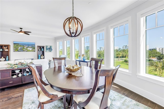 125 Belleview Blvd Unit 203, Belleair, FL 33756 - dining space with crown molding, healthy amount of natural light, a chandelier, dark wood finished floors, and a ceiling fan