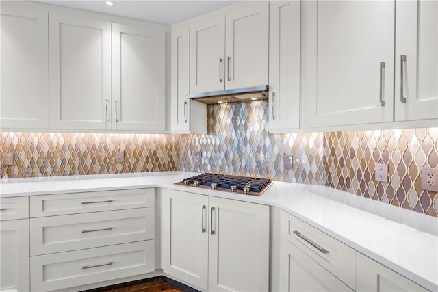 125 Belleview Blvd Unit 203, Belleair, FL 33756 - kitchen with stainless steel gas cooktop, light countertops, and white cabinetry