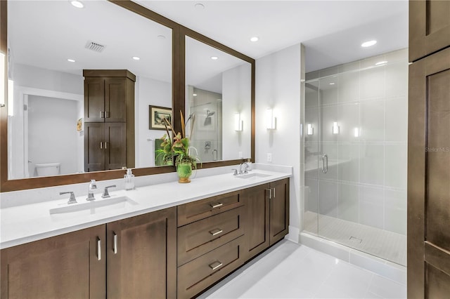 125 Belleview Blvd Unit 203, Belleair, FL 33756 - full bath with double vanity, a shower stall, and tile patterned flooring