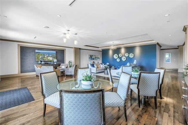 125 Belleview Blvd Unit 203, Belleair, FL 33756 - dining space with crown molding, hardwood / wood-style flooring, a chandelier, and recessed lighting