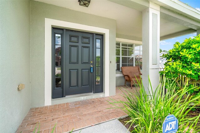17342 Lawn Orchid Loop, Land O Lakes, FL 34638 - entrance to property with covered porch and stucco siding