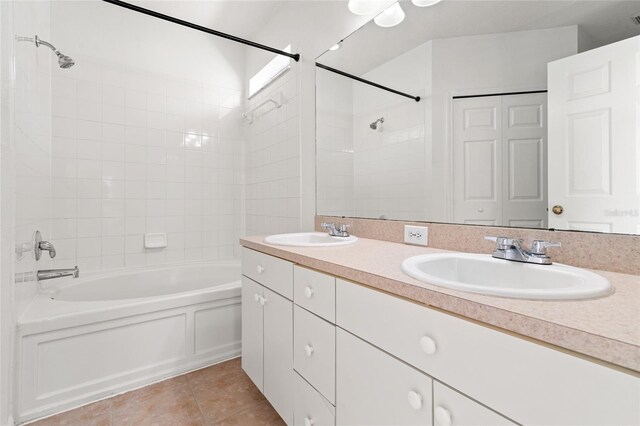 17342 Lawn Orchid Loop, Land O Lakes, FL 34638 - bathroom featuring washtub / shower combination, tile patterned floors, and double vanity