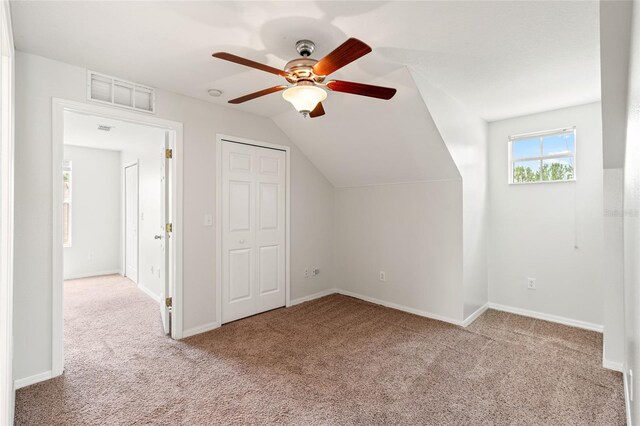 17342 Lawn Orchid Loop, Land O Lakes, FL 34638 - additional living space featuring carpet flooring, ceiling fan, vaulted ceiling, and baseboards