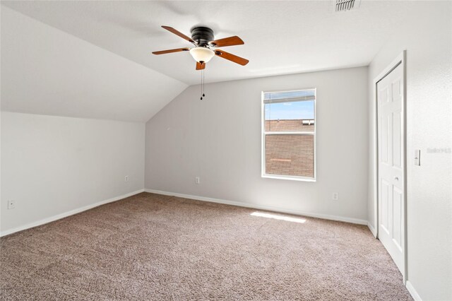 17342 Lawn Orchid Loop, Land O Lakes, FL 34638 - additional living space featuring carpet floors, a ceiling fan, baseboards, and vaulted ceiling