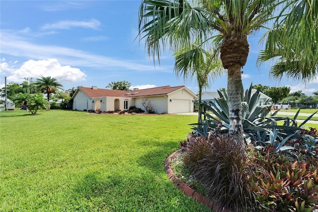 1414 75th St NW, Bradenton, FL 34209 - view of green lawn featuring a garage