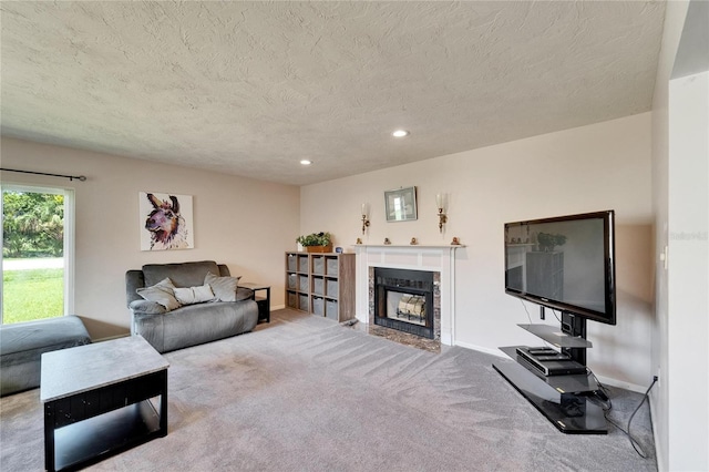 1414 75th St NW, Bradenton, FL 34209 - living area with a textured ceiling, carpet flooring, a fireplace with flush hearth, and recessed lighting
