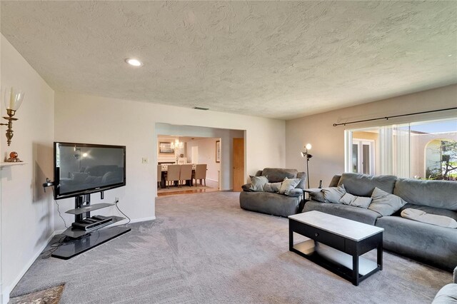 1414 75th St NW, Bradenton, FL 34209 - carpeted living room with a textured ceiling