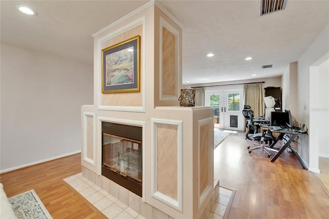 1414 75th St NW, Bradenton, FL 34209 - living room with light wood finished floors, an office area, french doors, and recessed lighting