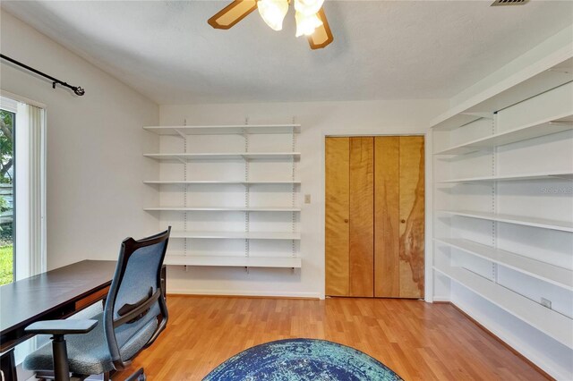 1414 75th St NW, Bradenton, FL 34209 - unfurnished office featuring light wood finished floors and a ceiling fan