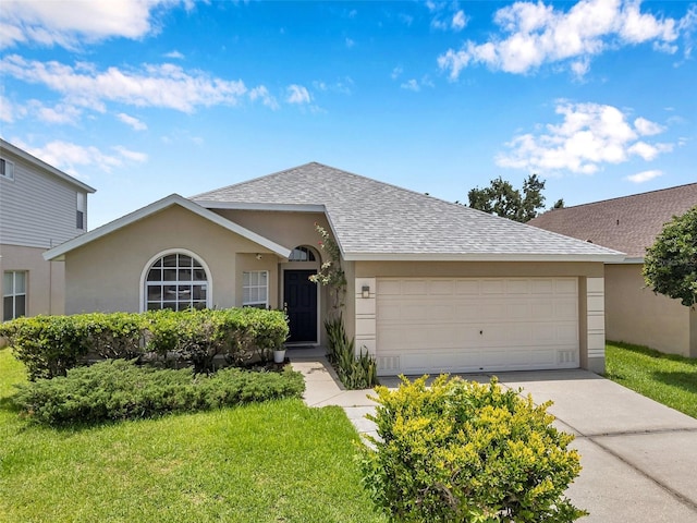 899 Addison Dr NE, Saint Petersburg, FL 33716 - single story home featuring roof with shingles, stucco siding, an attached garage, a front yard, and driveway
