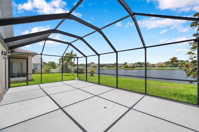 899 Addison Dr NE, Saint Petersburg, FL 33716 - view of patio featuring a water view and glass enclosure