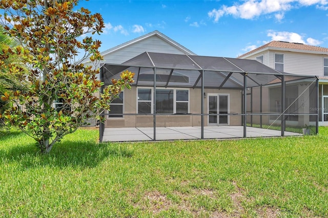 899 Addison Dr NE, Saint Petersburg, FL 33716 - back of house featuring a yard, a patio, and a lanai