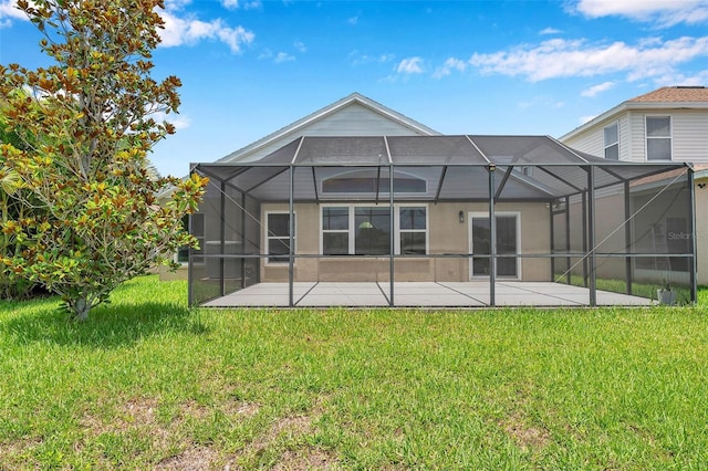899 Addison Dr NE, Saint Petersburg, FL 33716 - back of property featuring a patio area, a yard, and glass enclosure