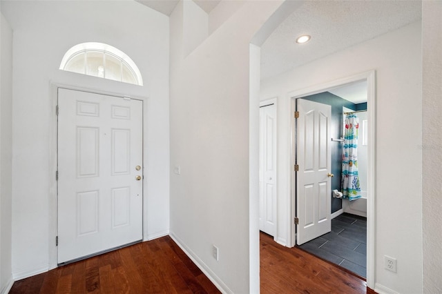 899 Addison Dr NE, Saint Petersburg, FL 33716 - entrance foyer with wood finished floors, arched walkways, plenty of natural light, and recessed lighting