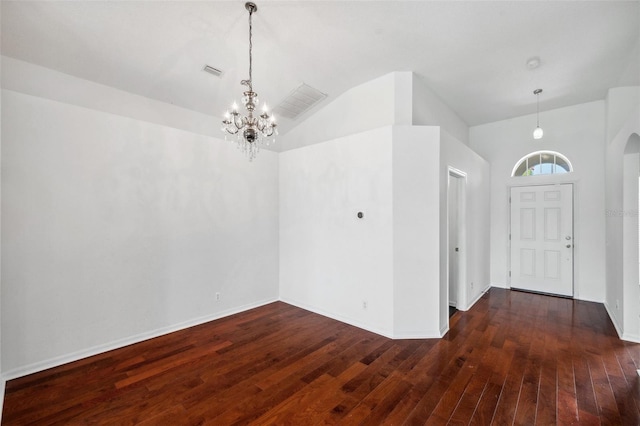 899 Addison Dr NE, Saint Petersburg, FL 33716 - entryway featuring a chandelier, hardwood / wood-style floors, lofted ceiling, and arched walkways