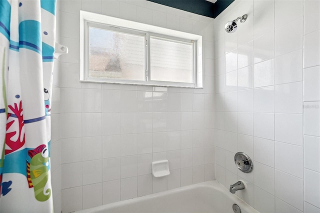 899 Addison Dr NE, Saint Petersburg, FL 33716 - full bathroom featuring shower / bath combo with shower curtain and healthy amount of natural light