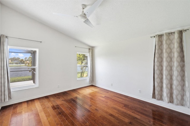 899 Addison Dr NE, Saint Petersburg, FL 33716 - empty room featuring lofted ceiling, hardwood / wood-style flooring, ceiling fan, and a textured ceiling