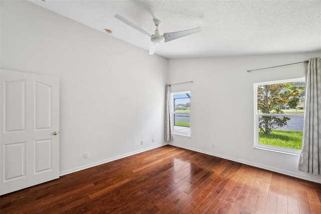 899 Addison Dr NE, Saint Petersburg, FL 33716 - unfurnished room featuring hardwood / wood-style floors, ceiling fan, and a textured ceiling