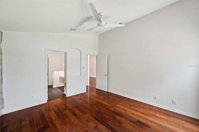 899 Addison Dr NE, Saint Petersburg, FL 33716 - unfurnished bedroom featuring wood-type flooring, lofted ceiling, ensuite bath, and ceiling fan