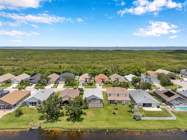 899 Addison Dr NE, Saint Petersburg, FL 33716 - aerial perspective of suburban area with a nearby body of water and a forest