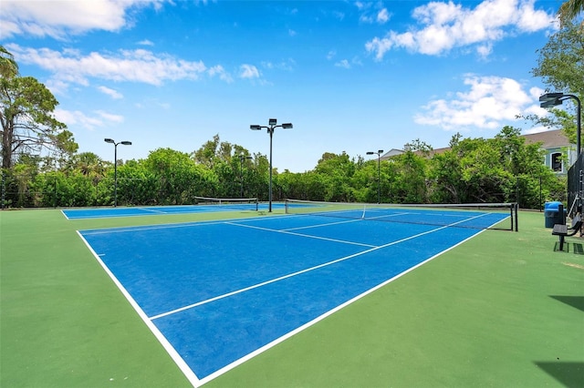899 Addison Dr NE, Saint Petersburg, FL 33716 - view of tennis court with community basketball court