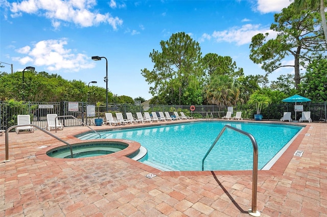 899 Addison Dr NE, Saint Petersburg, FL 33716 - community pool with a patio area and a community hot tub