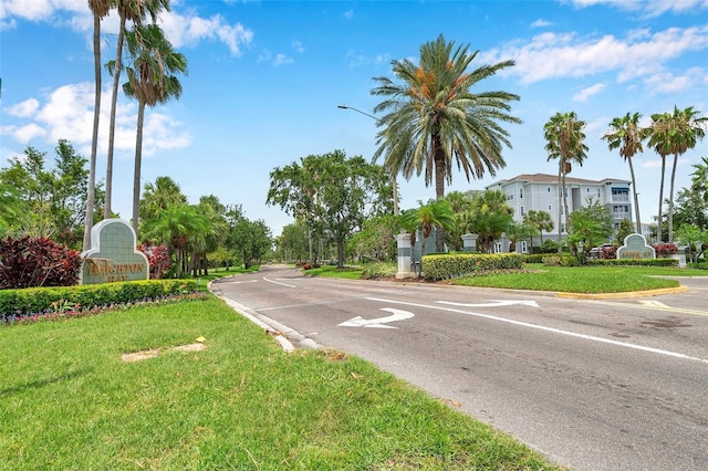 899 Addison Dr NE, Saint Petersburg, FL 33716 - view of asphalt road featuring street lighting and curbs