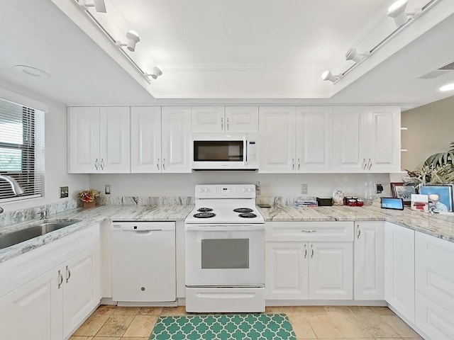 19451 Gulf Blvd Unit 205, Indian Shores, FL 33785 - kitchen with white appliances, white cabinets, and light stone counters