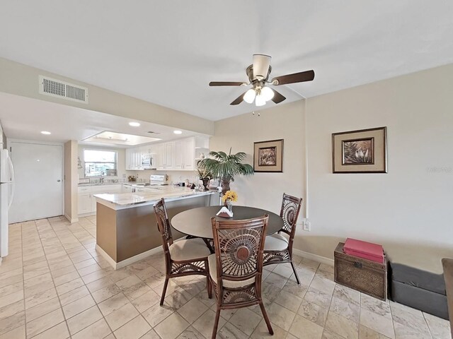19451 Gulf Blvd Unit 205, Indian Shores, FL 33785 - dining space featuring a ceiling fan and baseboards