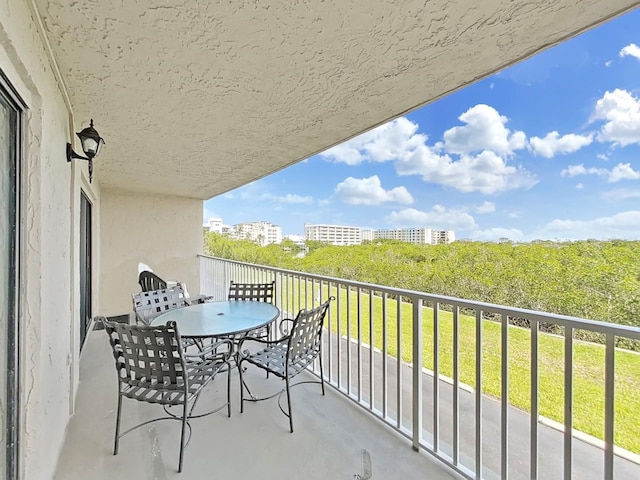 19451 Gulf Blvd Unit 205, Indian Shores, FL 33785 - balcony featuring outdoor dining area