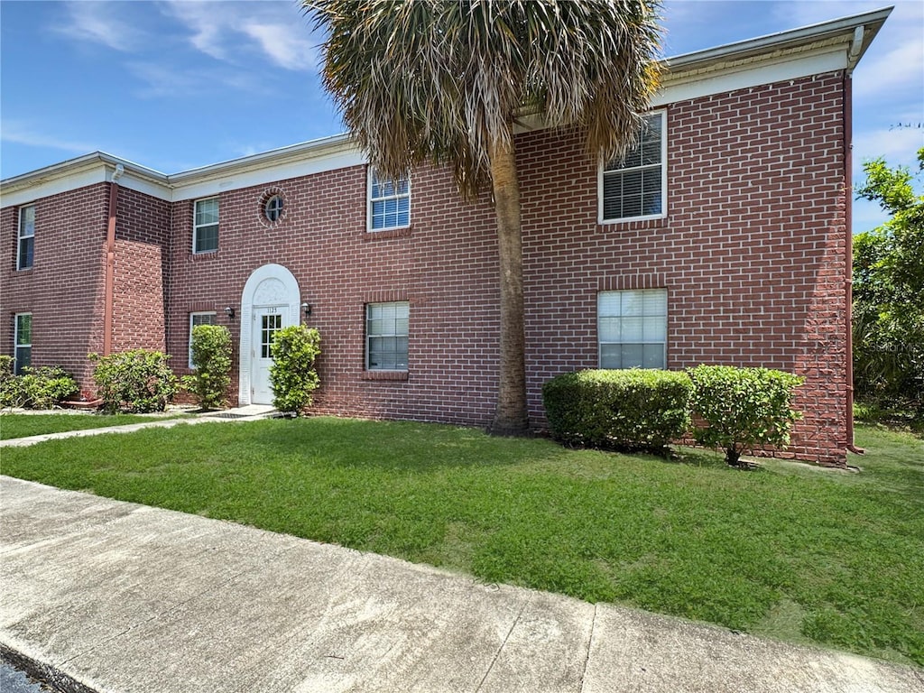 1125 83rd Ave N Unit D, Saint Petersburg, FL 33702 - view of front of property with a front lawn and brick siding