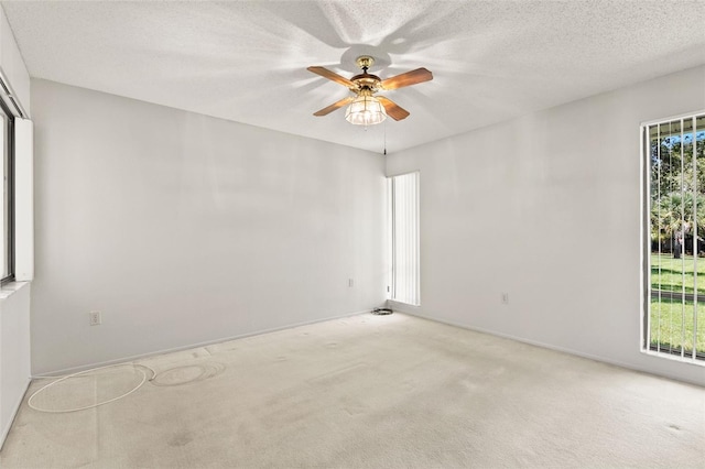 440 Lakeview Dr Unit 34, Palm Harbor, FL 34683 - spare room with a ceiling fan and carpet