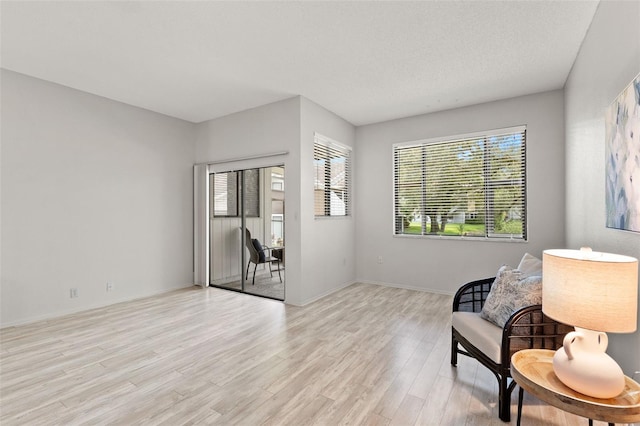 440 Lakeview Dr Unit 34, Palm Harbor, FL 34683 - sitting room featuring light wood finished floors