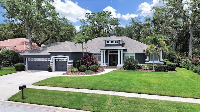 15024 Eaglepark Pl, Lithia, FL 33547 - view of front of house featuring a garage, concrete driveway, a front yard, stone siding, and a chimney