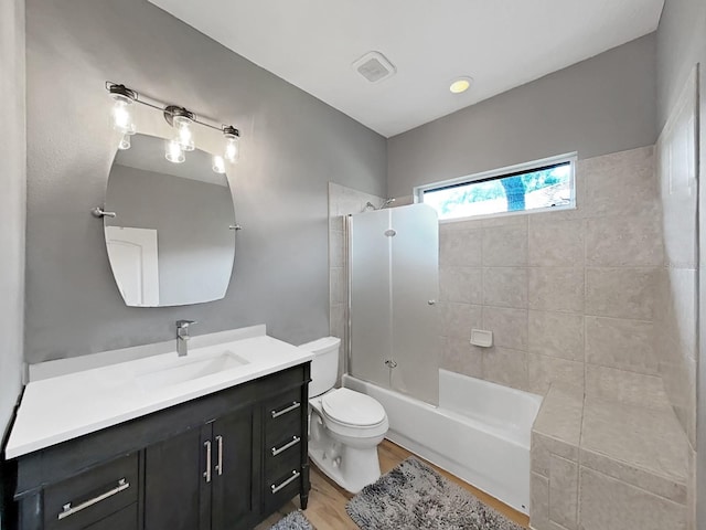 15024 Eaglepark Pl, Lithia, FL 33547 - bathroom featuring vanity, tub / shower combination, and wood finished floors