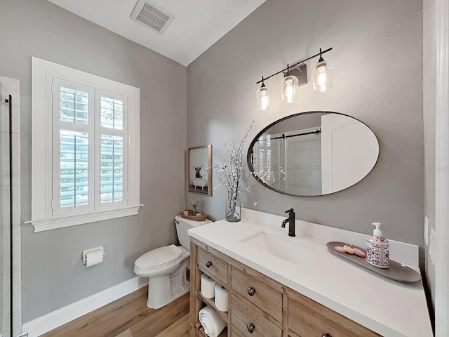15024 Eaglepark Pl, Lithia, FL 33547 - full bath with healthy amount of natural light, vanity, wood finished floors, and a shower