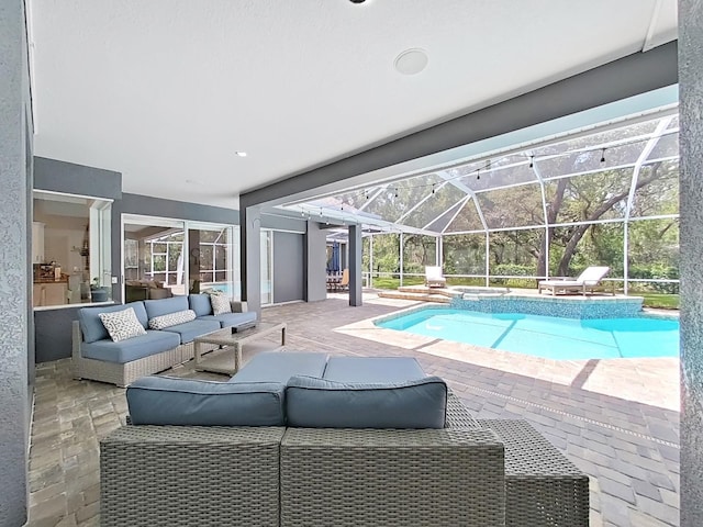 15024 Eaglepark Pl, Lithia, FL 33547 - view of pool featuring an outdoor hangout area, a patio area, a pool with connected hot tub, and a lanai