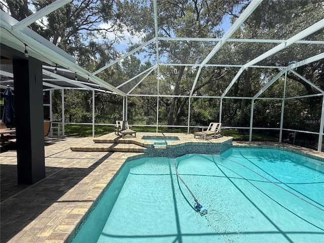 15024 Eaglepark Pl, Lithia, FL 33547 - view of swimming pool with a patio area and glass enclosure