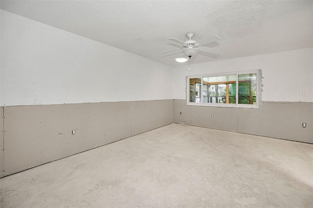 1660 Cape Ann Ave NE Unit 2, Saint Petersburg, FL 33702 - unfurnished room featuring concrete floors, ceiling fan, and a textured ceiling