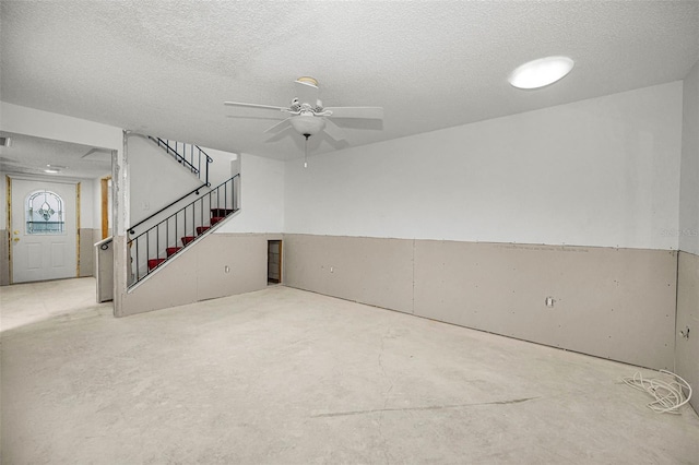 1660 Cape Ann Ave NE Unit 2, Saint Petersburg, FL 33702 - below grade area featuring ceiling fan, stairs, and a textured ceiling