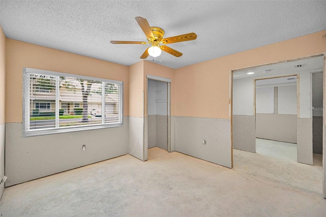 1660 Cape Ann Ave NE Unit 2, Saint Petersburg, FL 33702 - unfurnished bedroom with a textured ceiling and ceiling fan