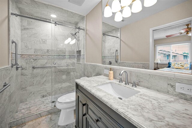 1660 Cape Ann Ave NE Unit 2, Saint Petersburg, FL 33702 - bathroom with toilet, vanity, marble look tiles, a shower stall, and tile walls