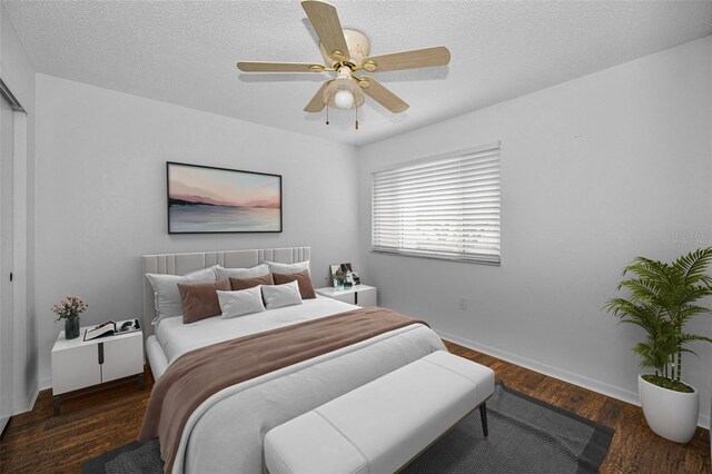 1660 Cape Ann Ave NE Unit 2, Saint Petersburg, FL 33702 - bedroom featuring a textured ceiling, wood finished floors, a ceiling fan, and baseboards