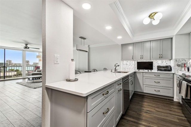 400 Island Way Unit 502, Clearwater Beach, FL 33767 - kitchen featuring gray cabinetry, crown molding, backsplash, a tray ceiling, and recessed lighting