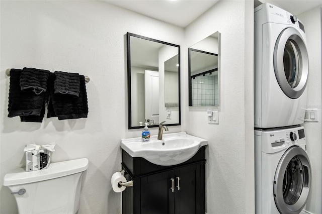 400 Island Way Unit 502, Clearwater Beach, FL 33767 - bathroom with stacked washing machine and dryer and vanity