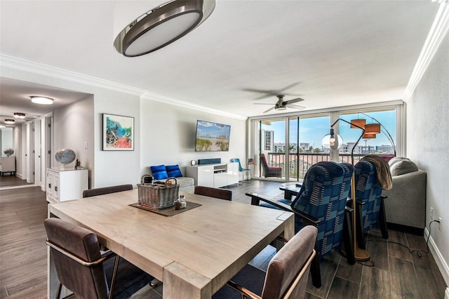 400 Island Way Unit 502, Clearwater Beach, FL 33767 - dining room with crown molding, dark wood-style floors, a ceiling fan, and a wall of windows